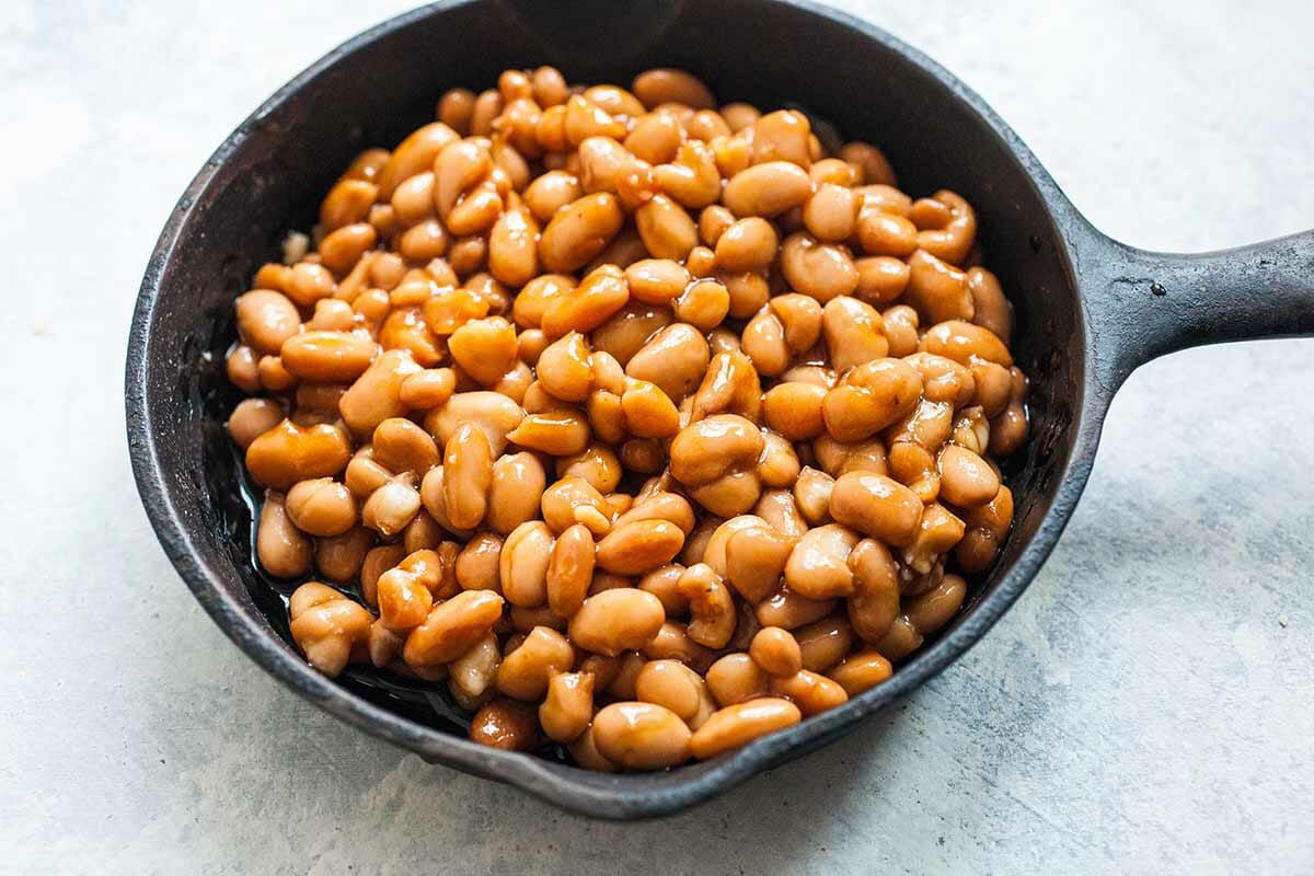 Cook the beans for a traditional british breakfast in a separate skillet