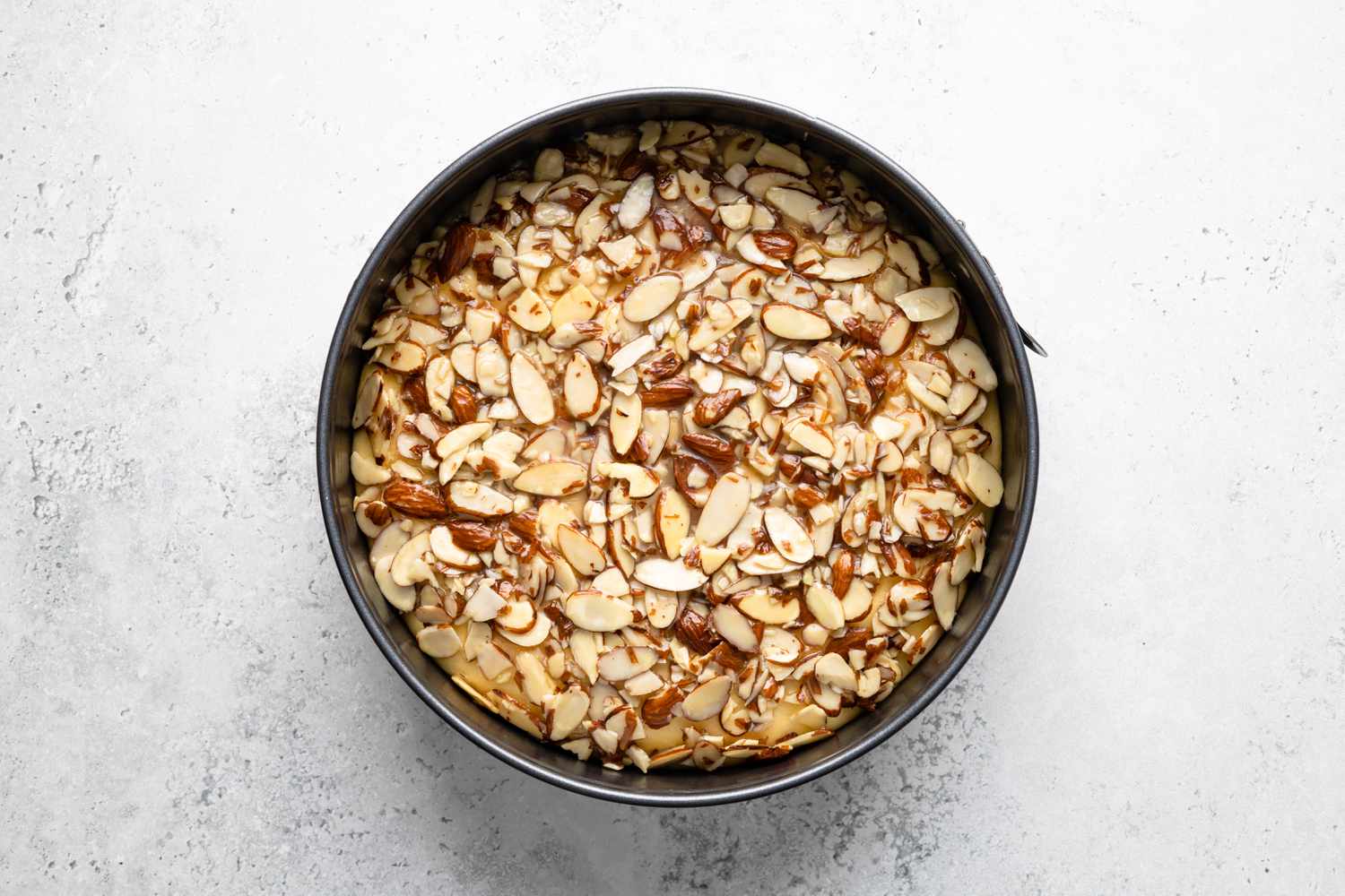 Almond Topping Added to Bee Sting Cake in Springform Pan