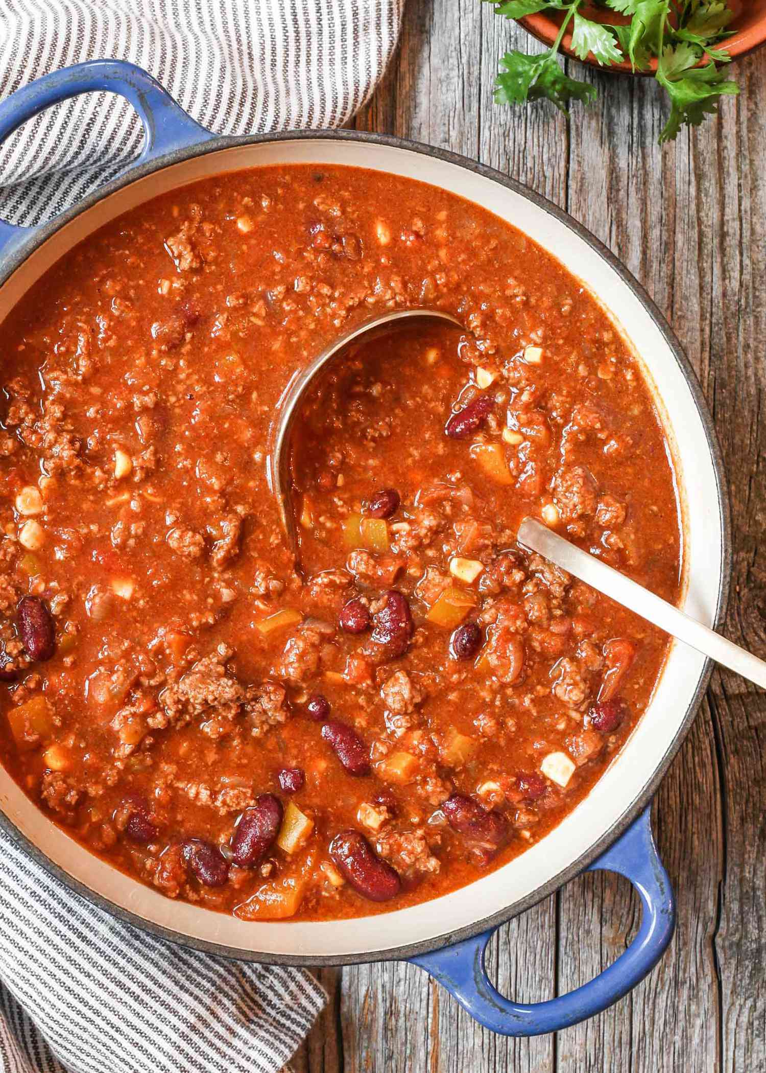 Best chili in a dutch oven with a ladle.