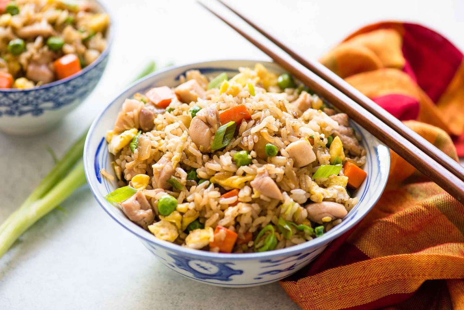 Chicken Fried Rice recipe in a bowl with chopsticks