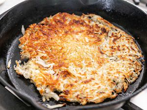 Hash Browns Cooking in a cast iron skillet