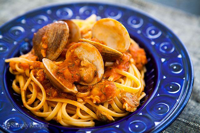 linguine and clams on a blue plate