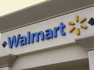 Exterior view of a Walmart store with its logo and signage visible on the building