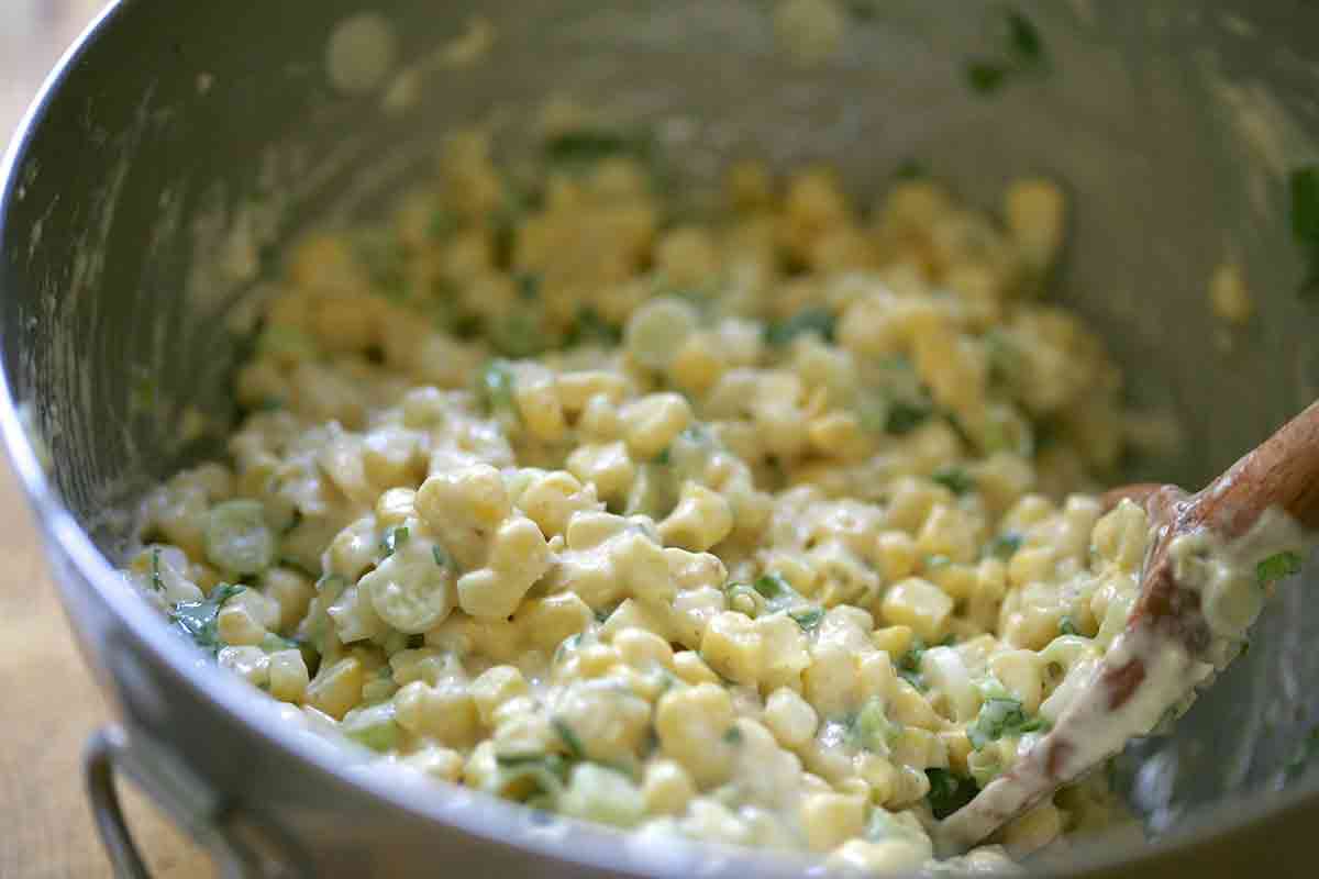 mix corn into fritter batter