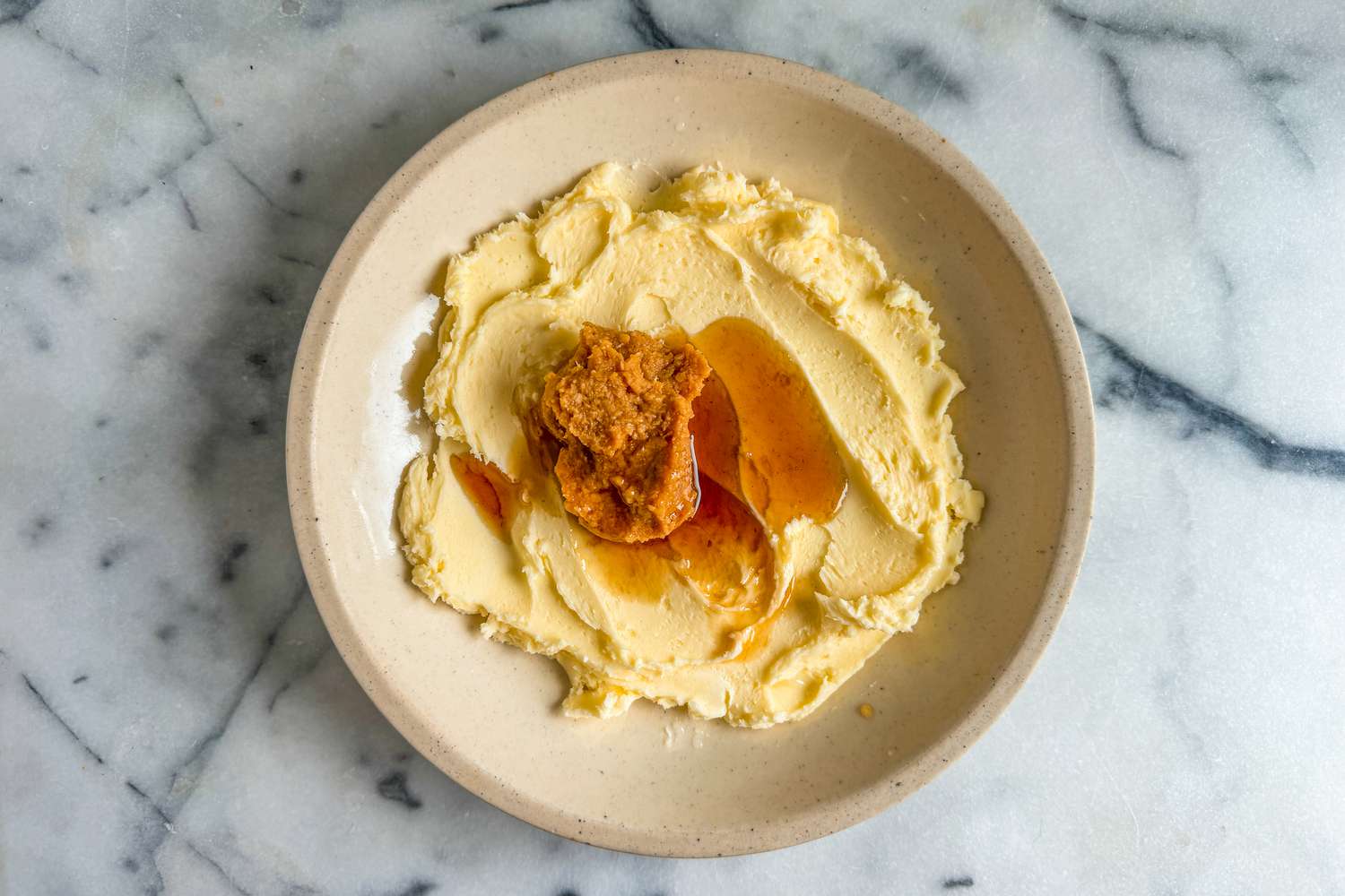 Bowl of butter, miso paste, and sesame oil