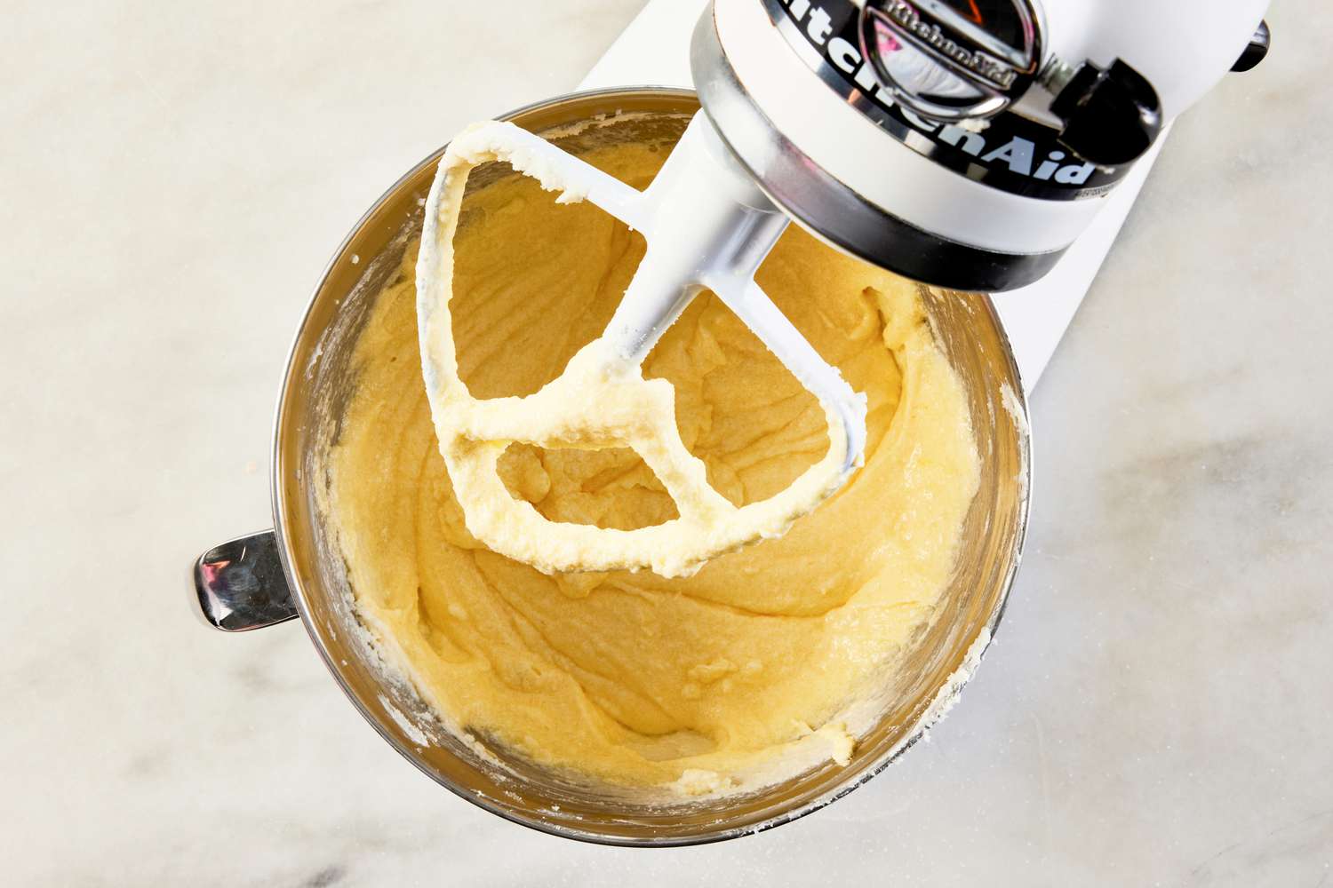 eggs whisked into the butter sugar mixture in the stand mixer for 7UP bundt cake recipe