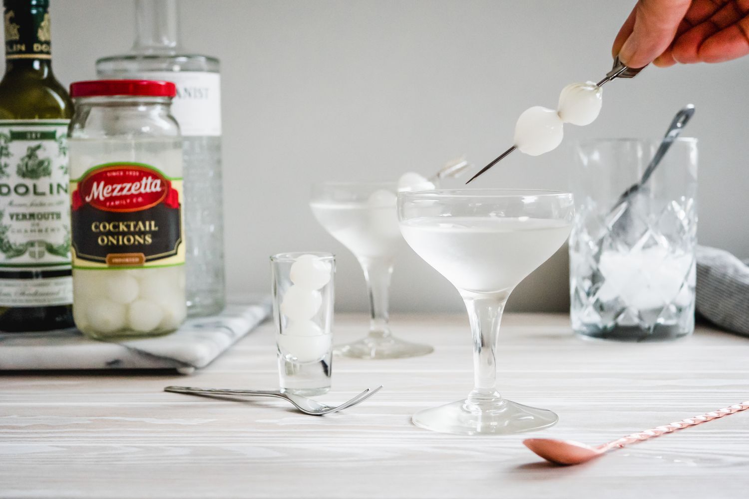 Pickled Onion Garnish Added to Gibson Cocktail