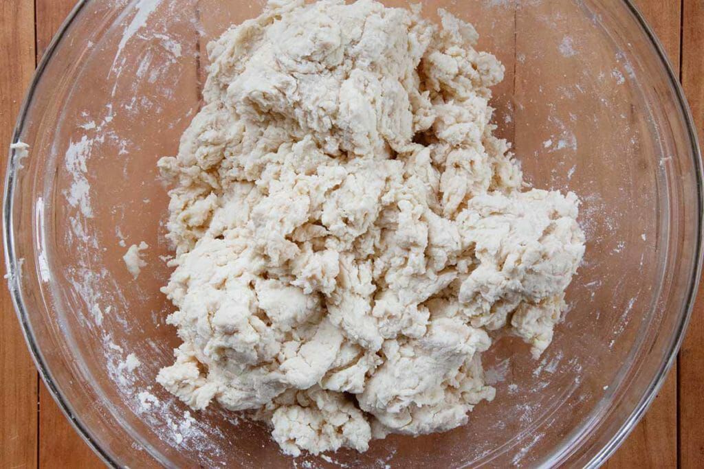 Mixing angel biscuit dough made with yeast baking soda and baking powder