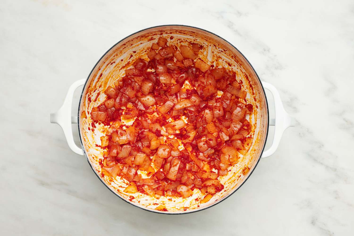 Tomato sauce stirred into the cooked onions for meatball sub soup recipe
