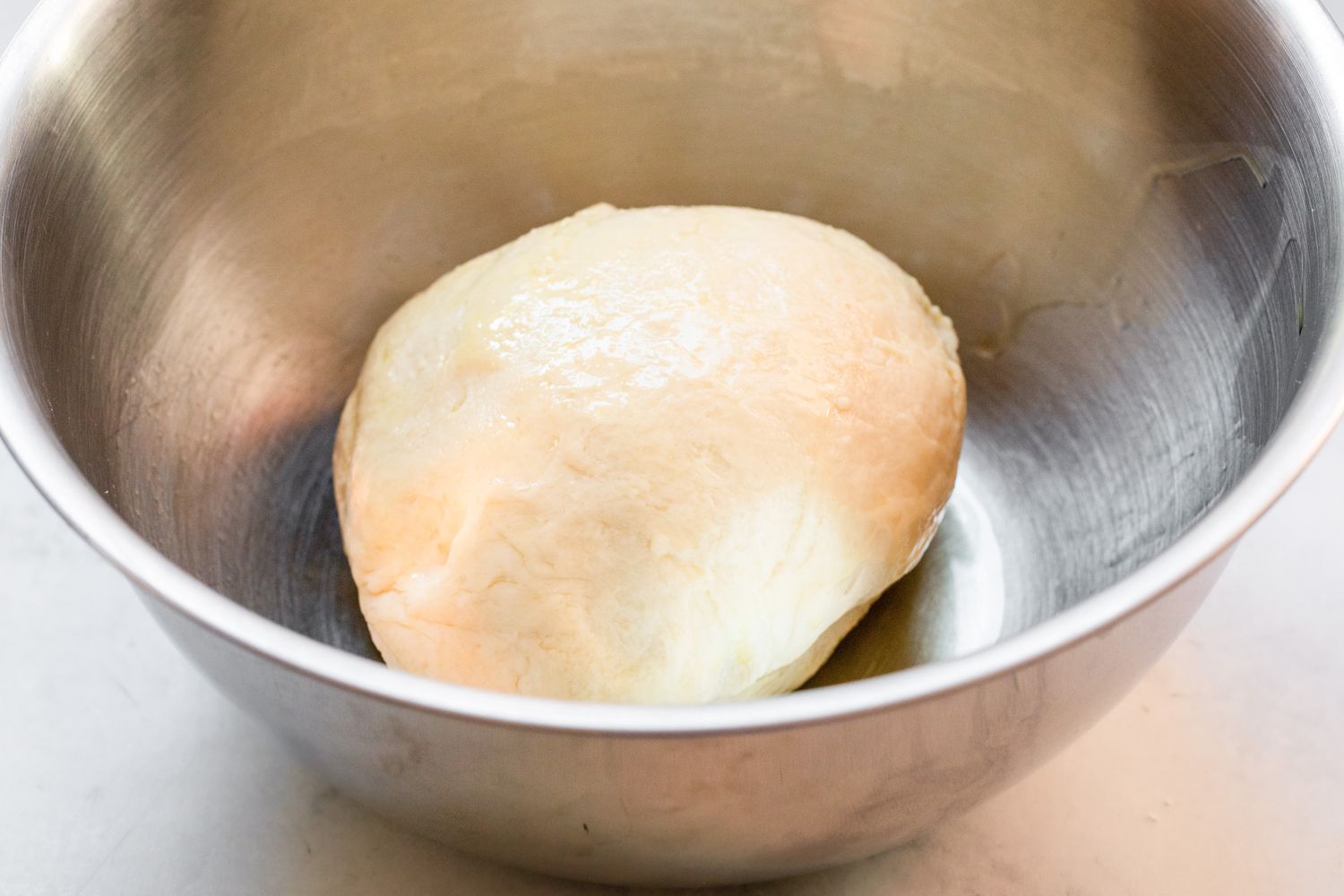 Breadsticks Dough Resting in an Oiled Bowl