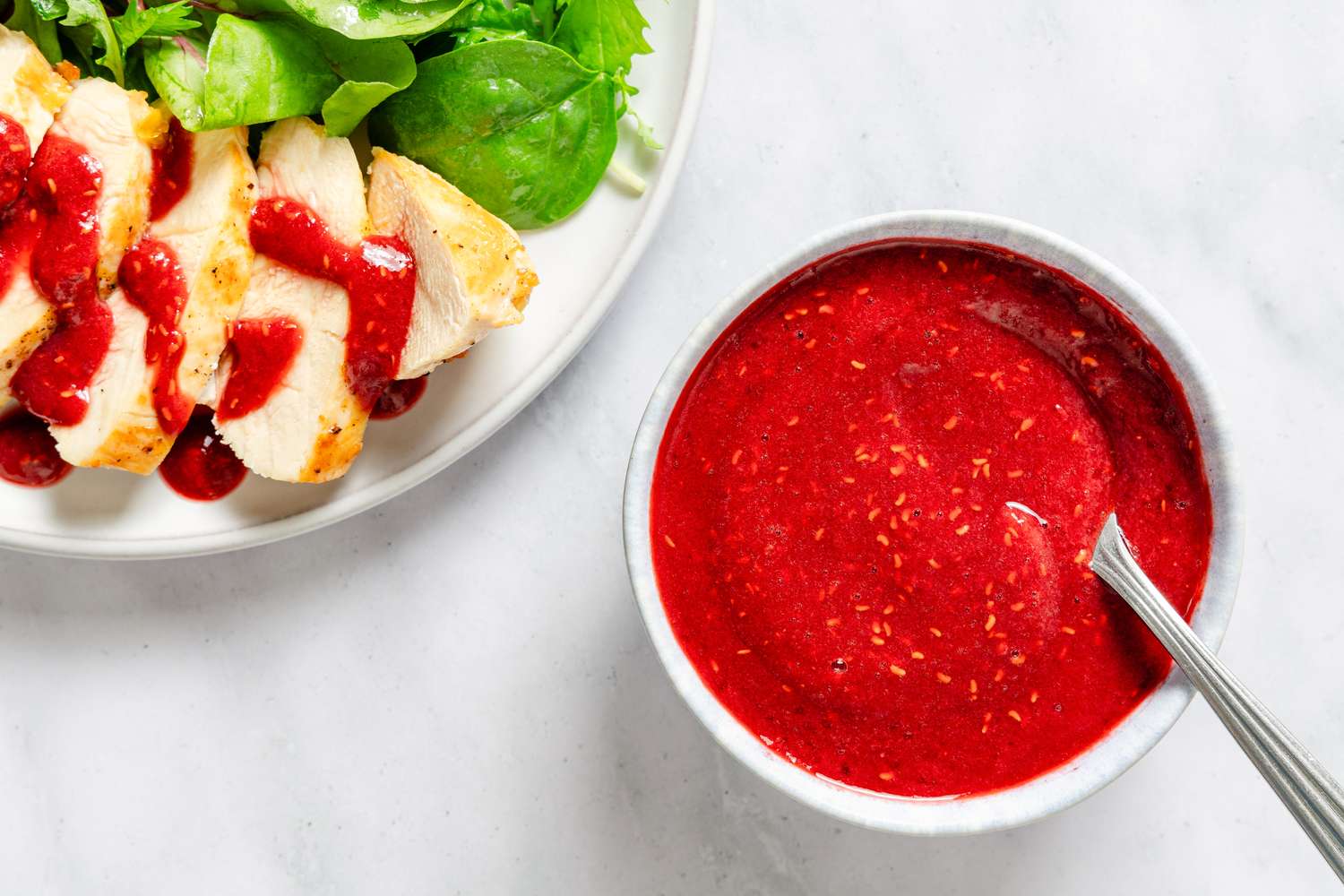 Raspberry-Soy Sauce in a small bowl with a spoon