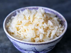 Coconut rice made with coconut, coconut water, and coconut oil in a round bowl