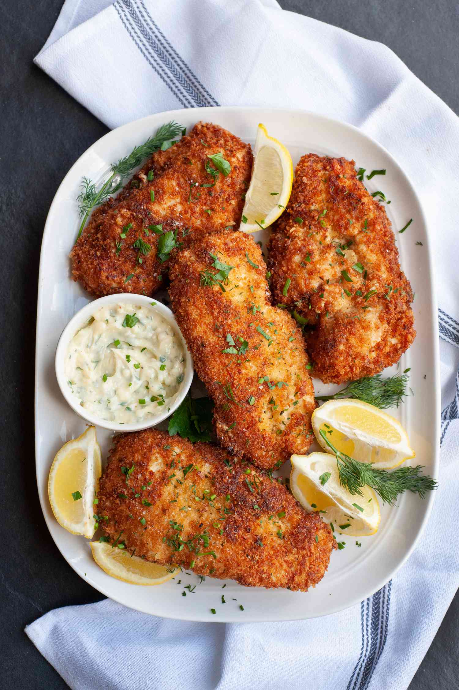 Chicken Kiev on a white platter.