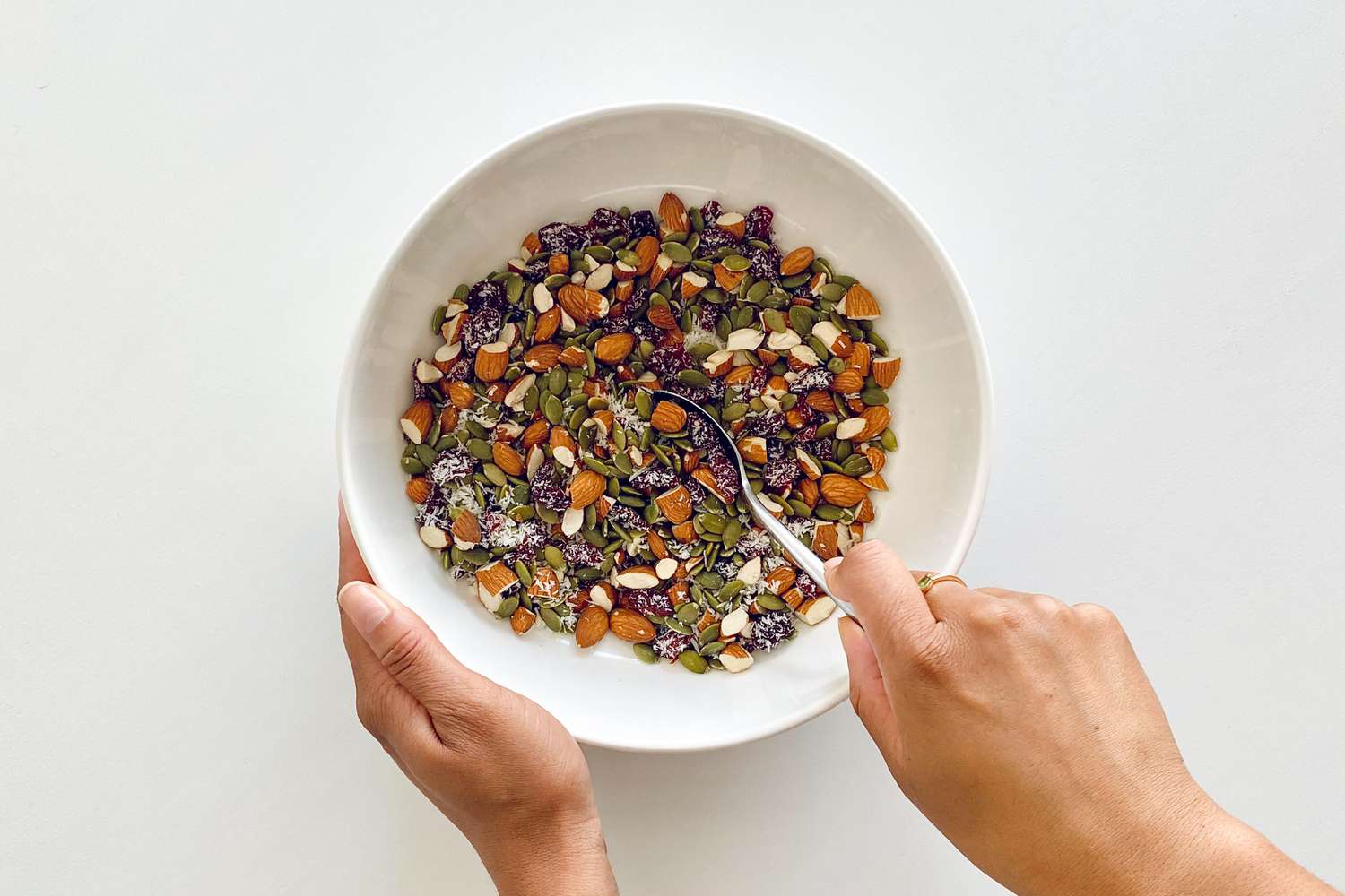Mixing nuts and seeds in a bowl for Granola Bars.