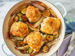 crispy chicken thighs with zucchini and shallots in a dutch oven