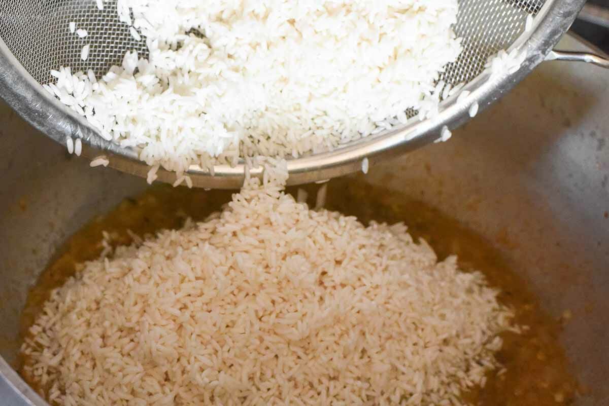 Steamed Rice with Pork add the drained rice to the pot