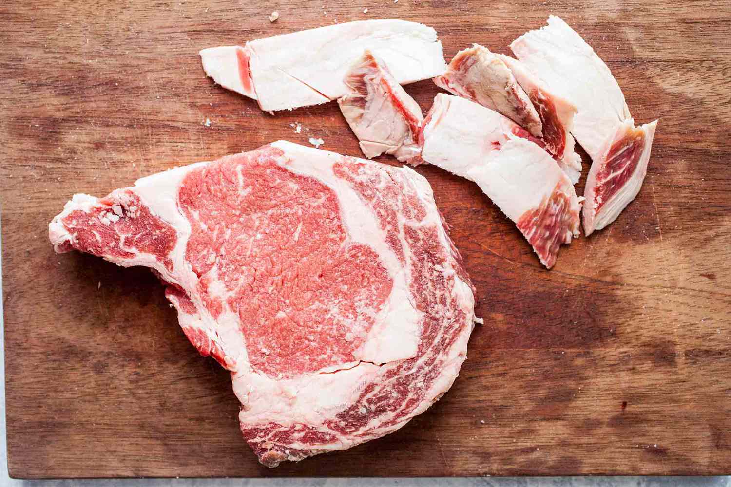Trim the fat from the ribeye before grilling steak