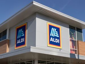Exterior of an Aldi store showing the logo prominently displayed on its facade