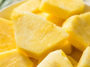 Sliced pineapple pieces arranged close together