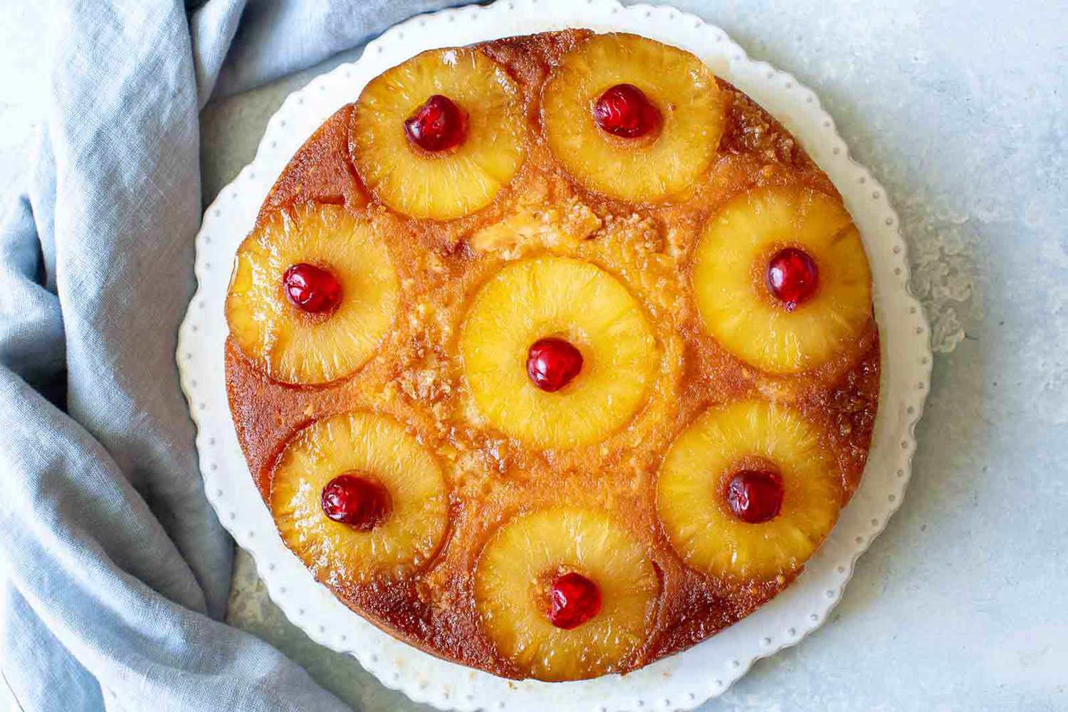 A pineapple upside down cake on a platter
