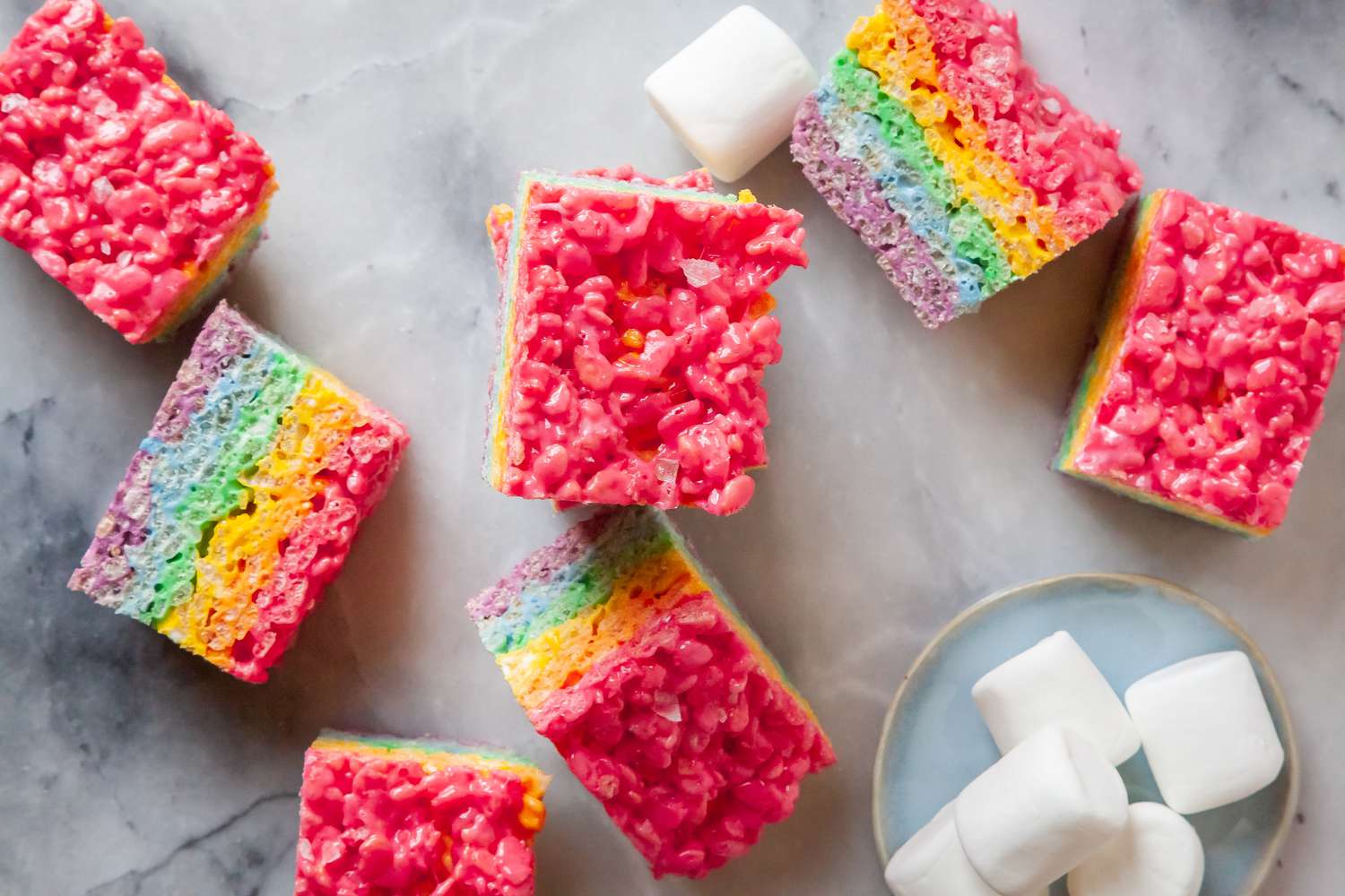 Rainbow Rice Krispies Treats Next to Lots of Marshmallows