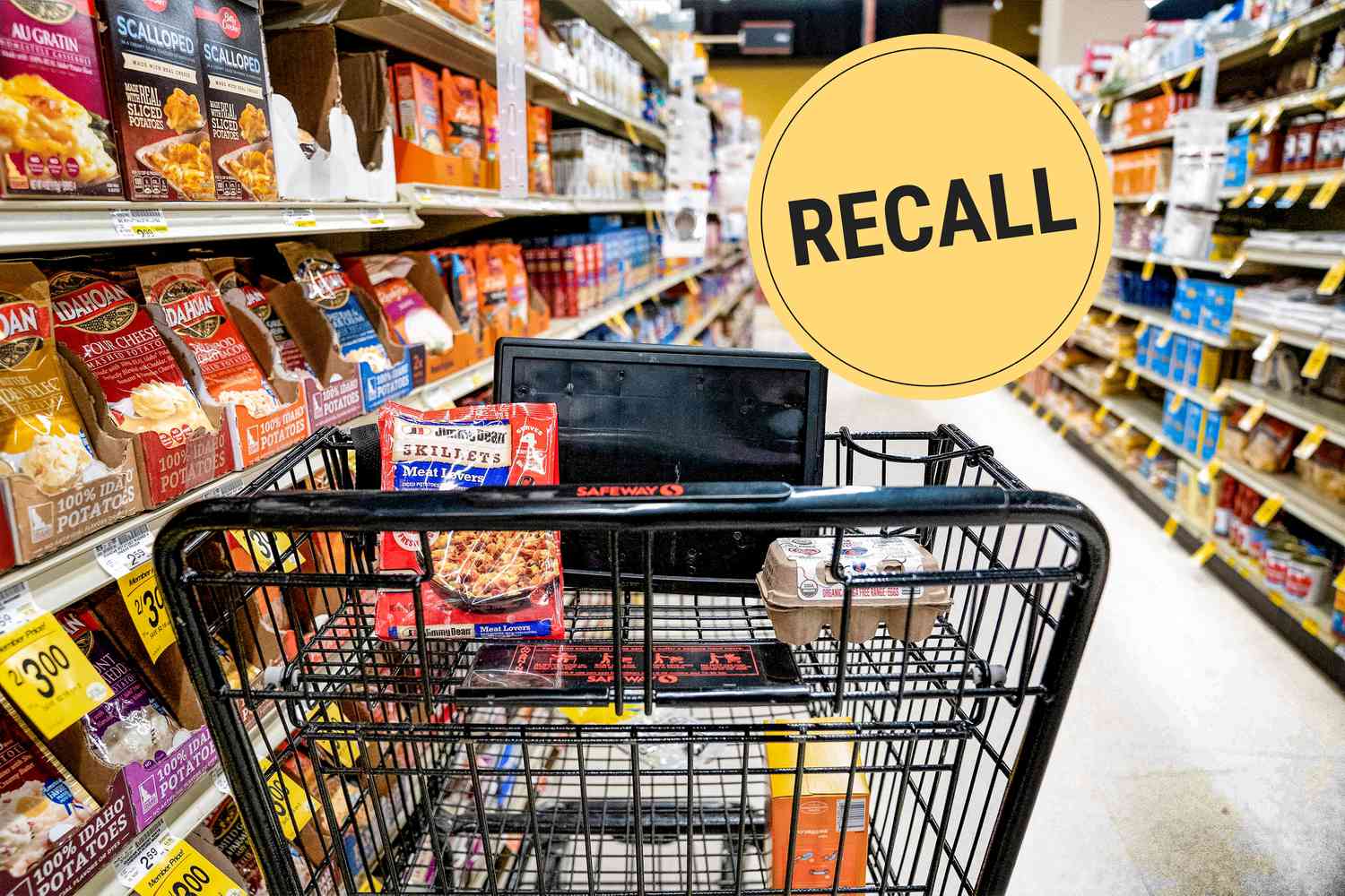 Looking down a supermarket aisle from behind a shopping cart.