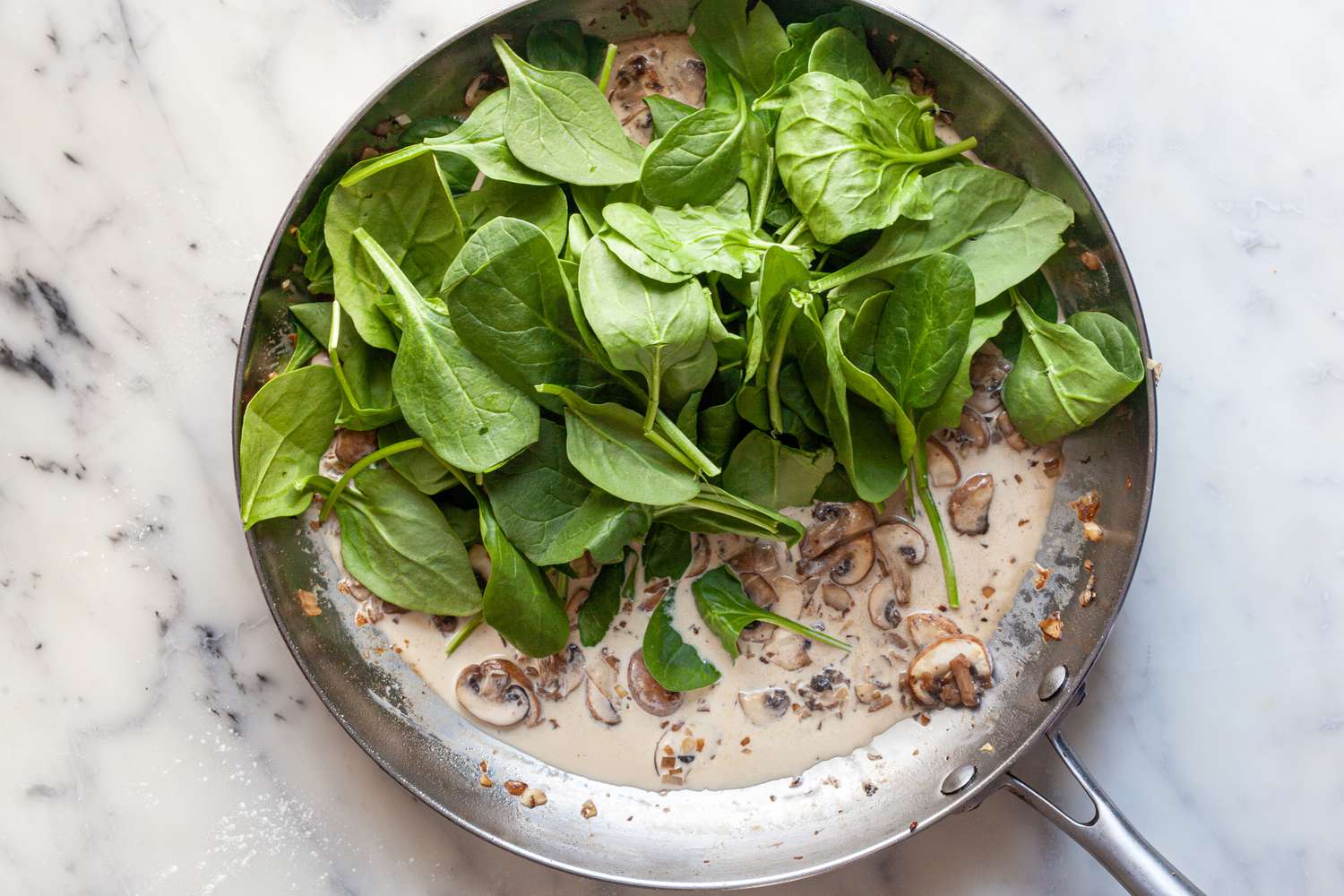 Add spinach in 2 or 3 batches.