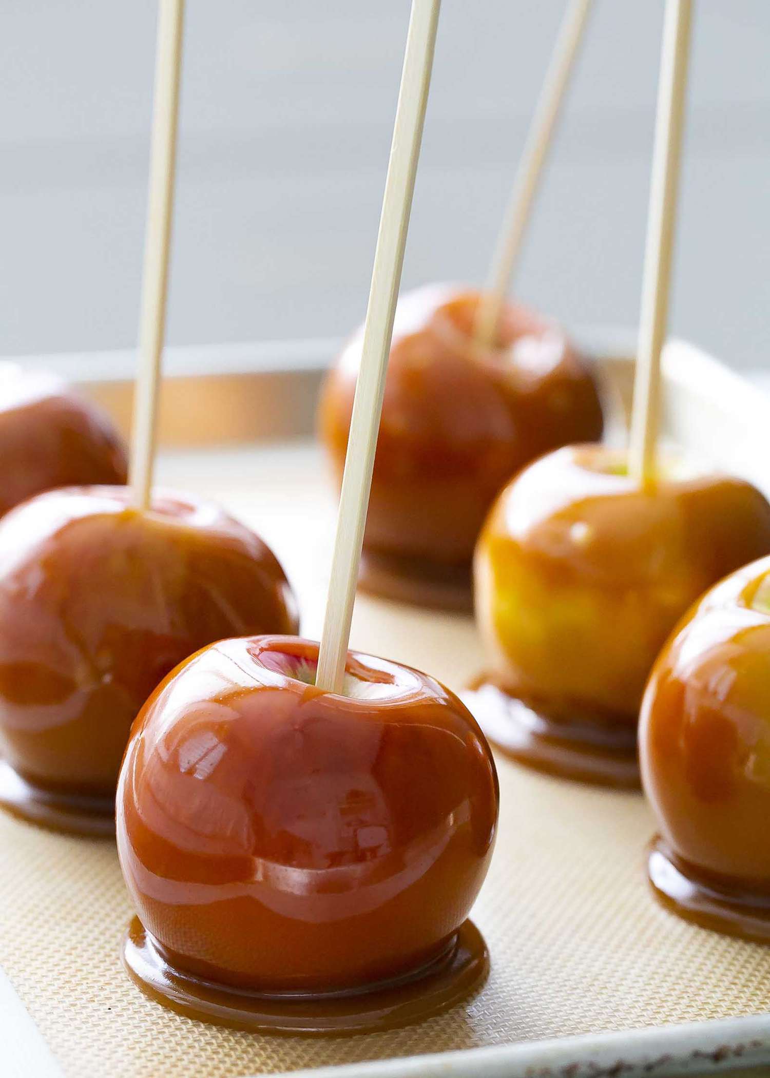 Caramel Apples Recipe caramel apples on a baking sheet