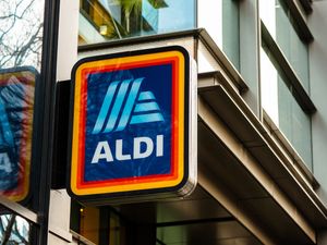 A sign with the Aldi logo on a building