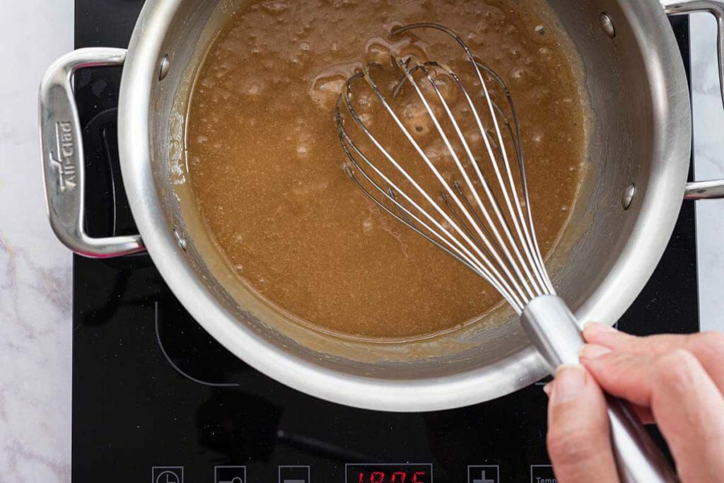 Easy Banoffee Cheesecake - whisking toffee sauce