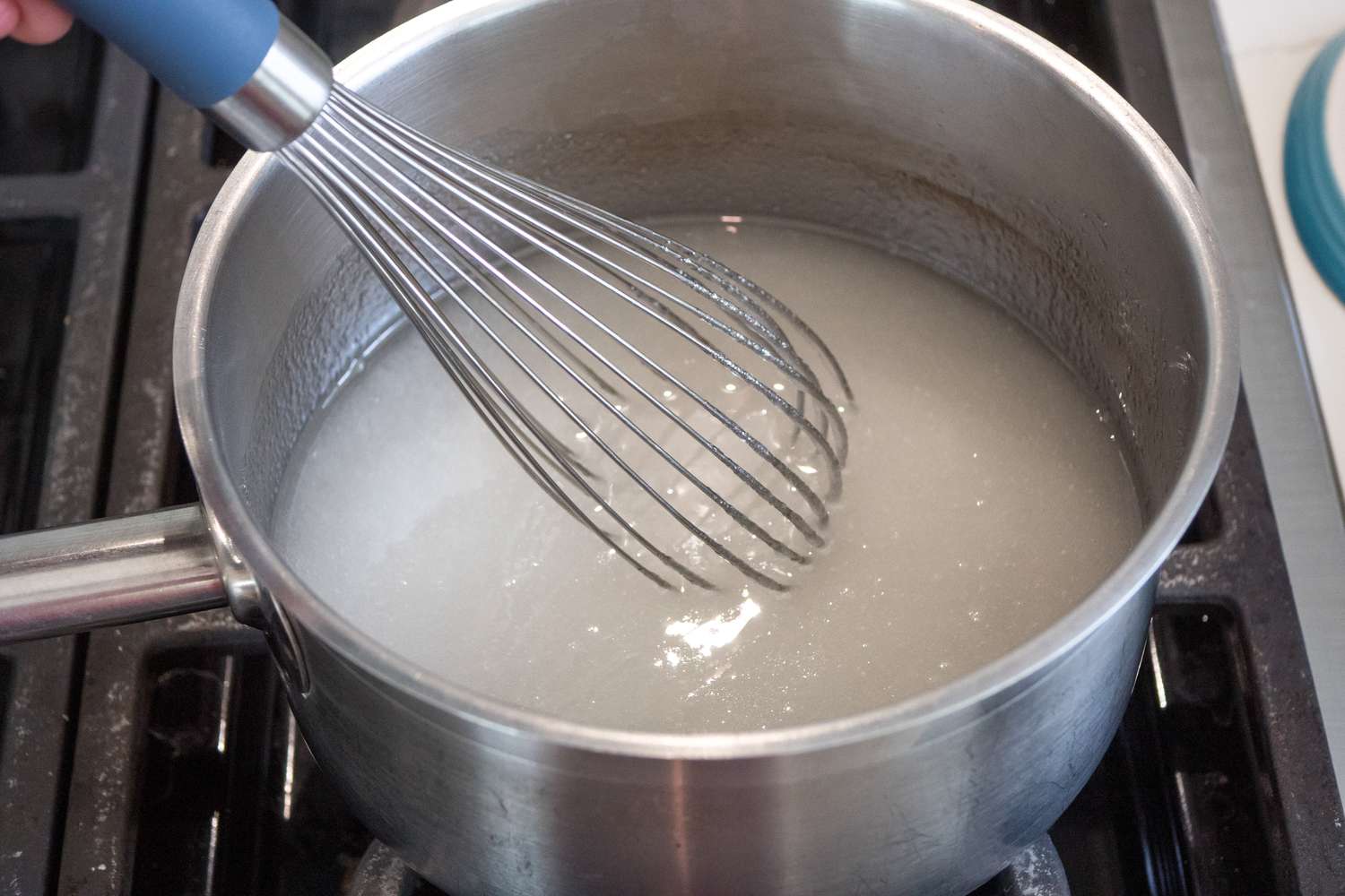 Agar-Agar Mixture Whisked Together in a Pot over the Stove for Vegan Marshmallows