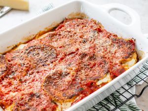 Baked eggplant parmesan in a casserole dish.