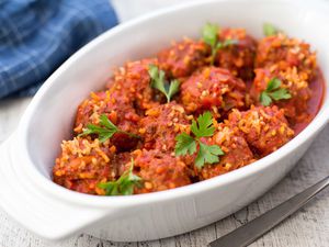 Porcupine meatballs with rice in a white dish