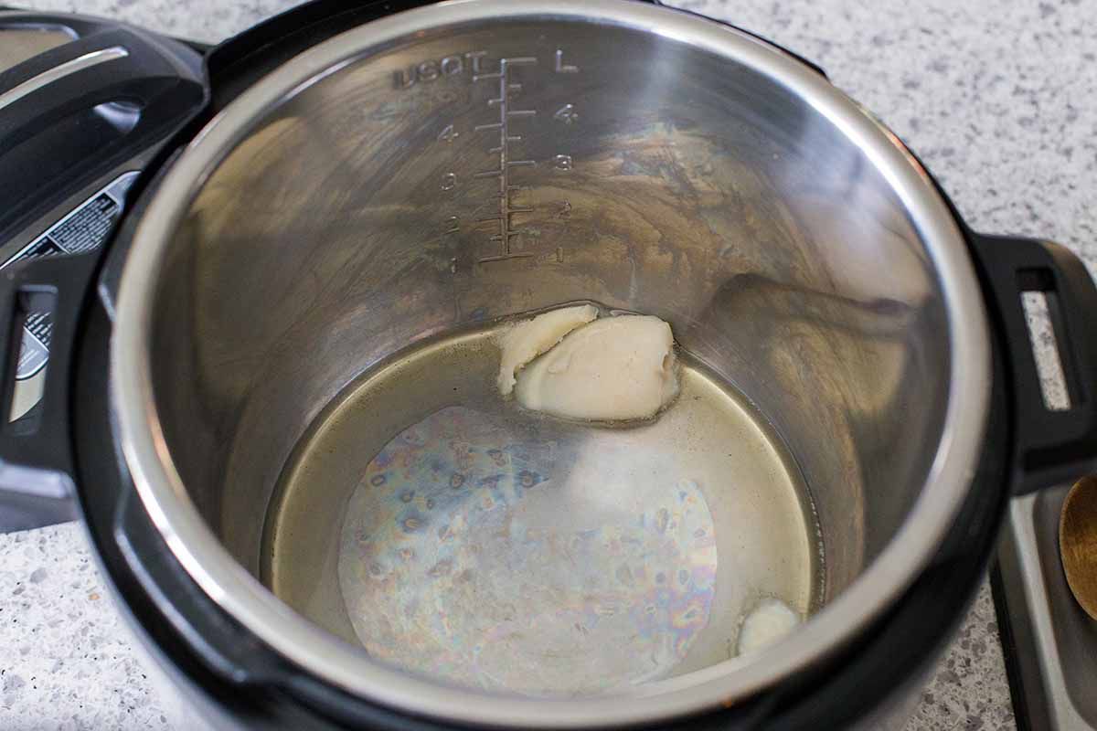 Lard melting in the insert of an instant pot.