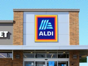 The storefront of an Aldi supermarket with a visible logo sign