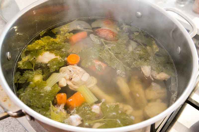 Stockpot of vegetables to make easy chicken noodle soup.