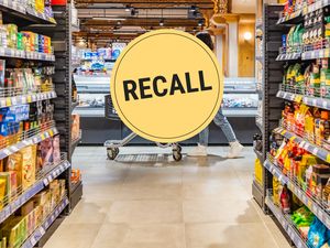 Grocery store aisle with a recall notice icon overlayed