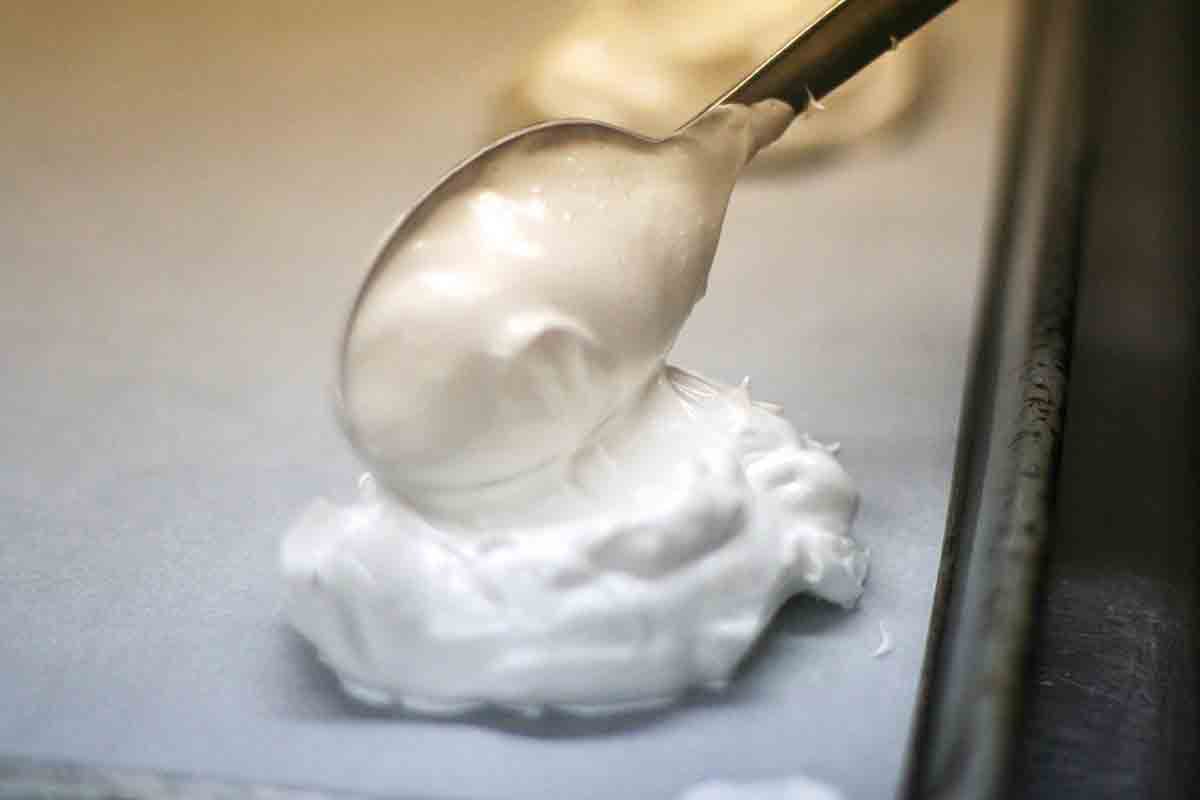 spoon meringue onto baking sheet