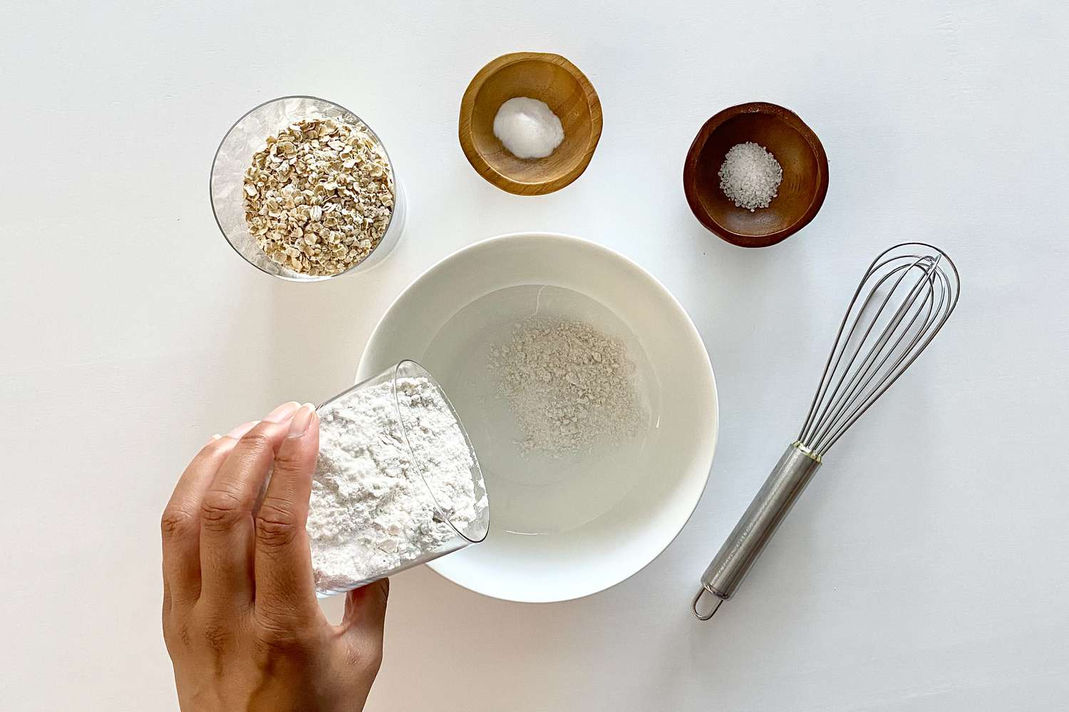 Adding flour to a bowl to make Bar Cookies of the Gluten Free Monster Variety.