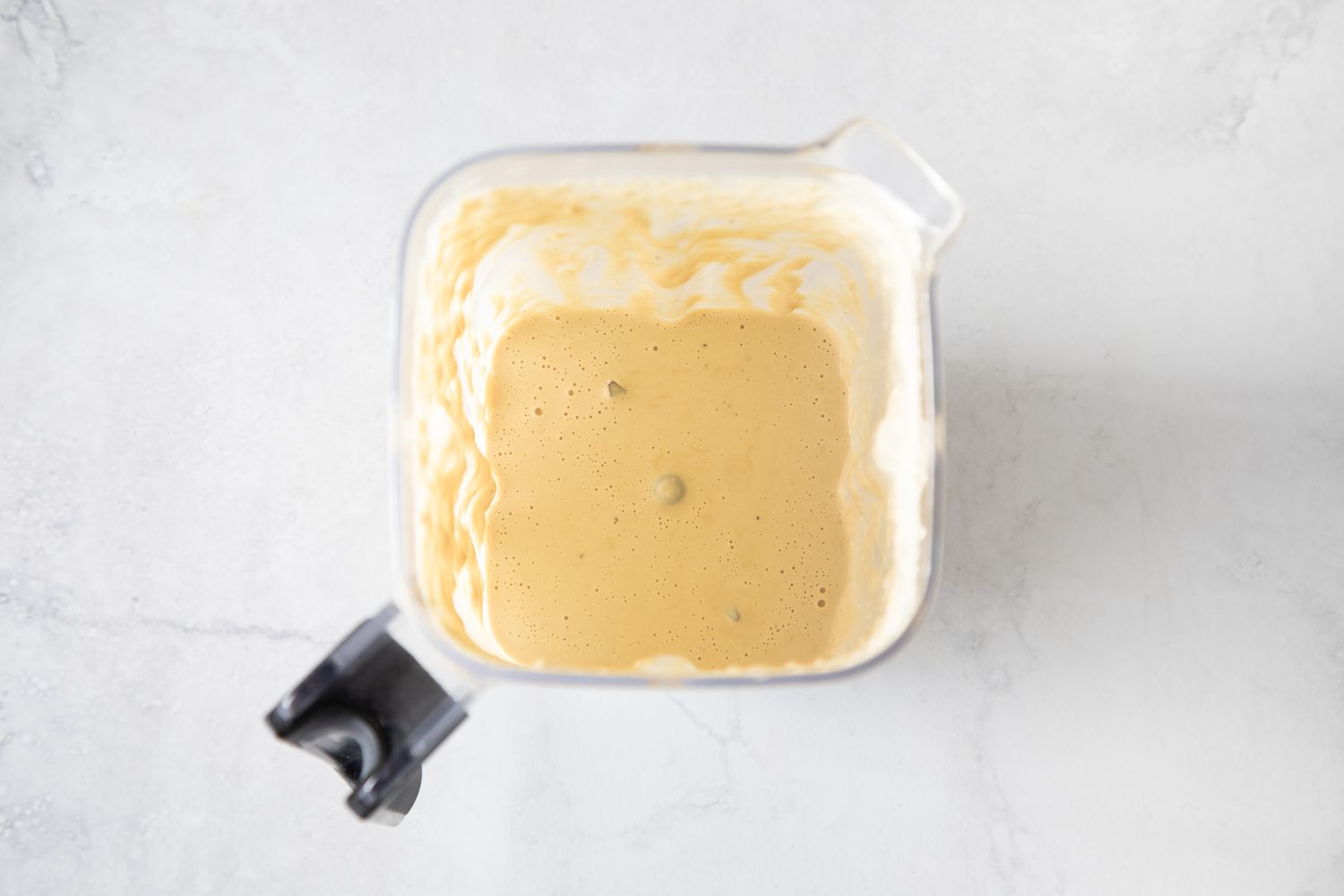 Creamy consistency of vegan caesar dressing