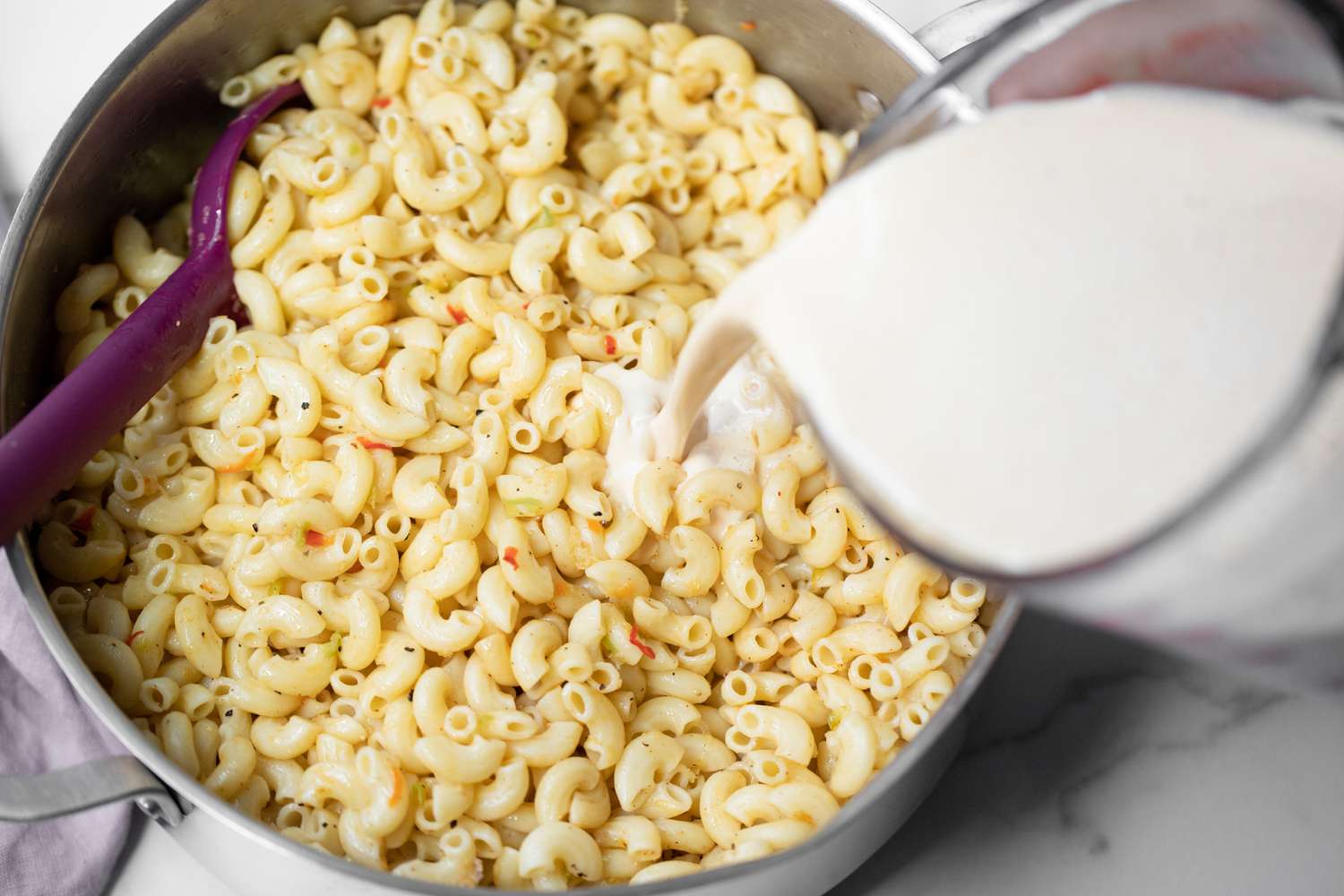 Egg-Milk Mixture Added to Pot of Trinidadian Macaroni Pie
