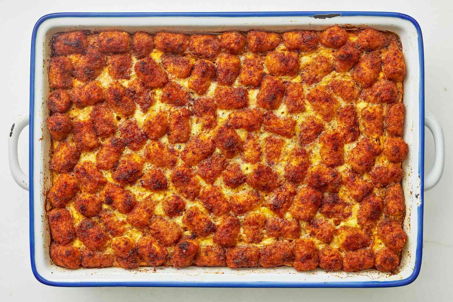 Baked corned beef tater tot casserole in a casserole dish
