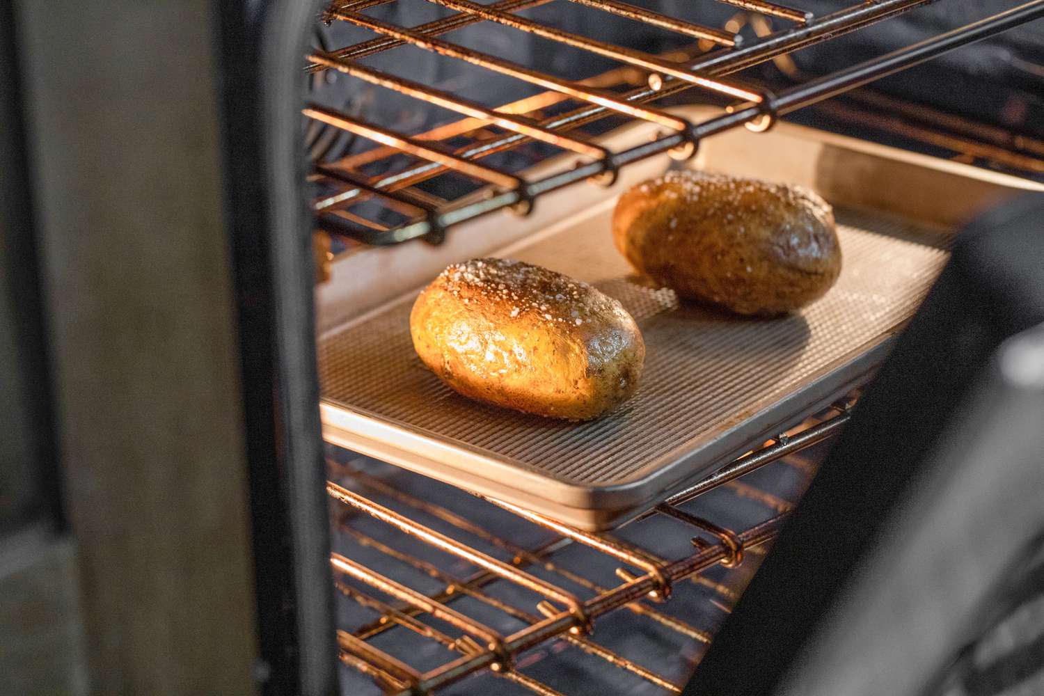 Microwave Baked Potato Roasting in the Oven to Crisp the Skin 