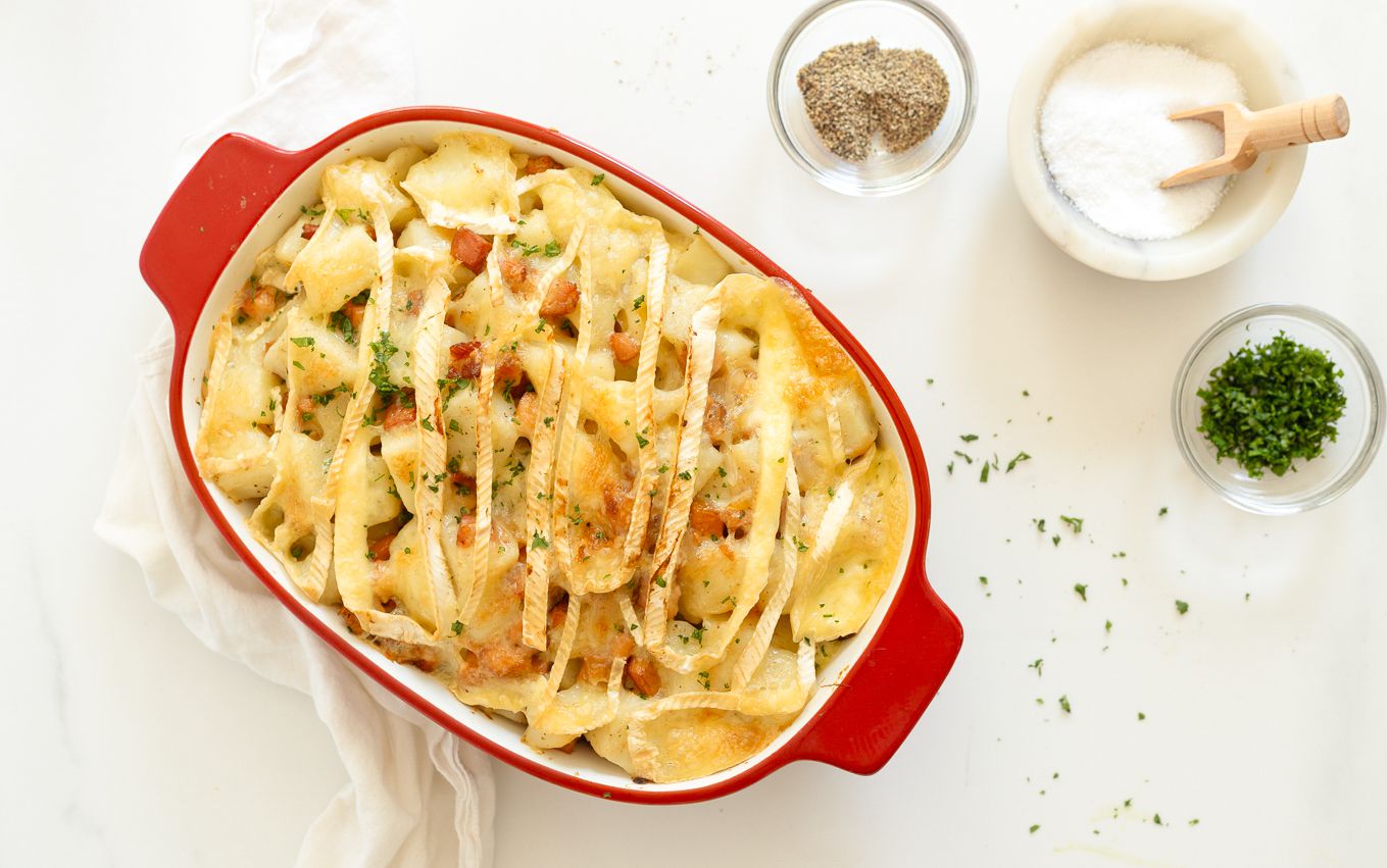 A red baking dish with Anthony Bourdain's Tartiflette recipe