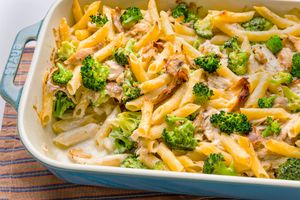 Chicken Alfredo pasta bake with broccoli in a casserole dish