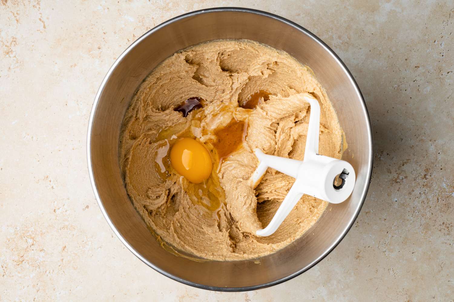 Eggs Added to Peanut Butter Mixture for Peanut Blossom Cookies 