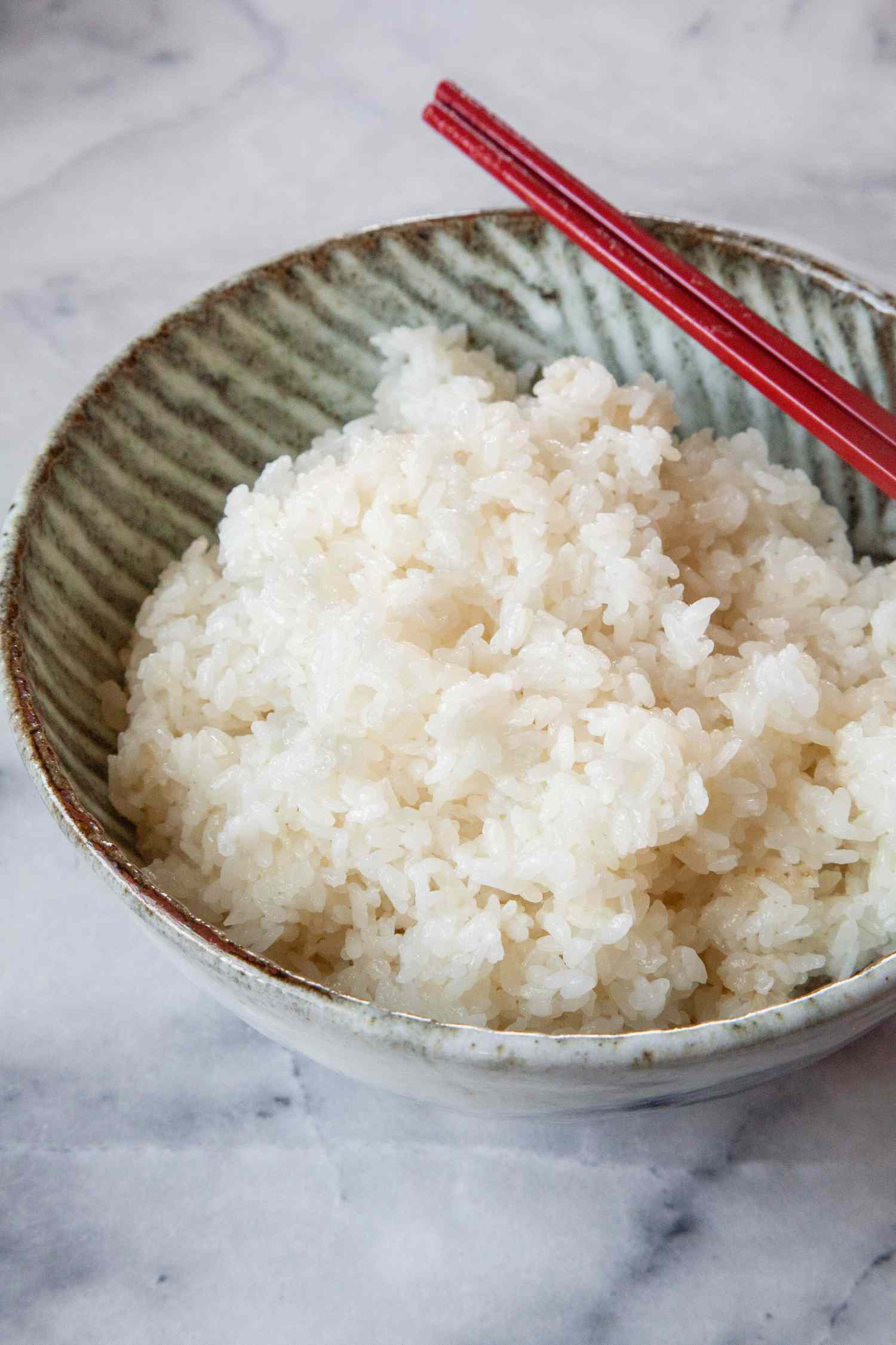Sushi Rice in a Bowl with Chopsticks
