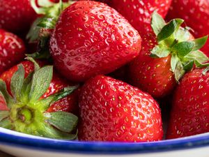 close up of strawberries in a bowl