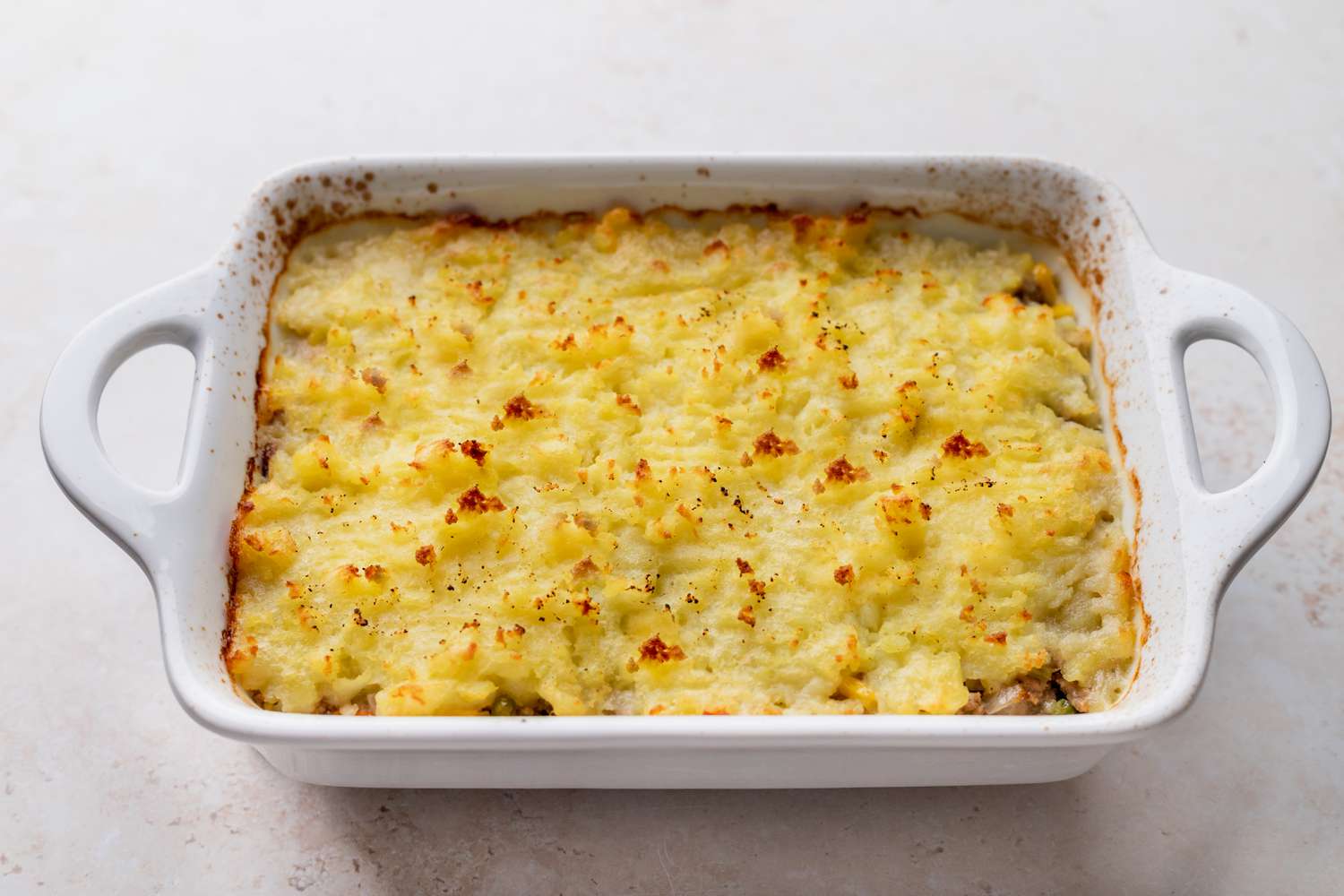 Shepherd's pie in a white casserole dish.