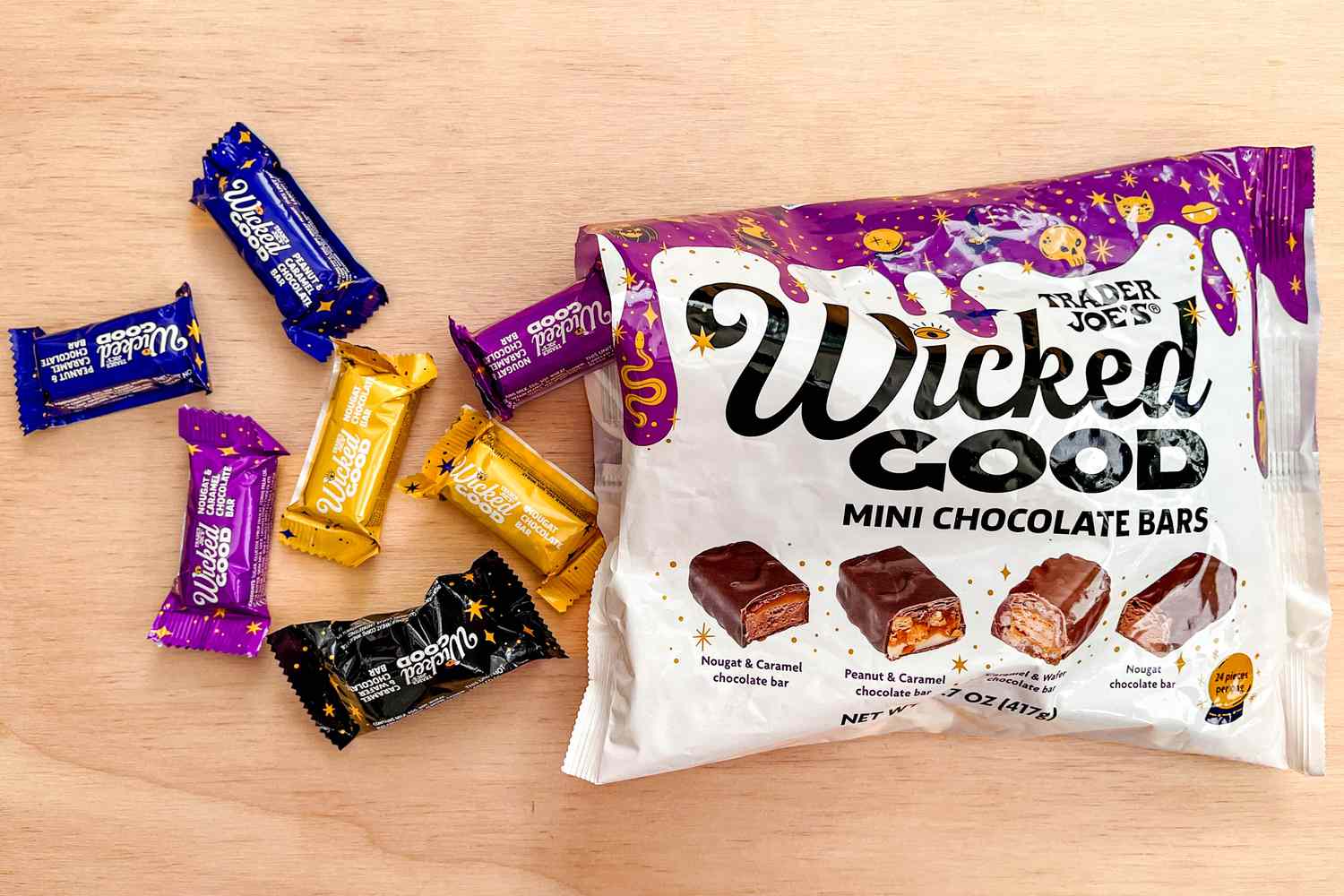 An opened bag of Trader Joe's Wicked Good Mini Chocolate Bars with some chocolate bars on the counter next to the bag